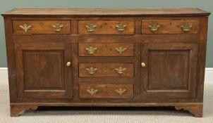 19TH CENTURY OAK DRESSER BASE, having a 'T' arrangement of drawers with brass drop handles,