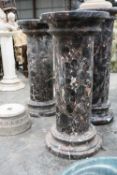 LARGE PAIR OF VARIEGATED MARBLE PEDESTALS, modelled as columns, moulded capital and bases, 107cms (