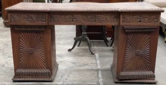 ANGLO-INDIAN CARVED HARDWOOD PEDESTAL DESK, gadrooned and foliate carved with cupboard doors, plinth