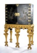 WILLIAM & MARY BLACK & GILT JAPANNED CABINET, c. 1700, exterior shallow relief decorated with