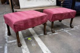 SIMILAR PAIR OF GEORGIAN STYLE DRESSING STOOLS, with lion's paw feet, stuffover seats, overcovered