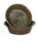TWO VICTORIAN LARGE CIRCULAR BRASS MILK PANS, 84cms & 75cms (d) Comments: Larger splits to rim,