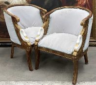 PAIR OF EMPIRE STYLE PARCEL GILT BERGERE ARMCHAIRS, reeded moulded backs with swan carved