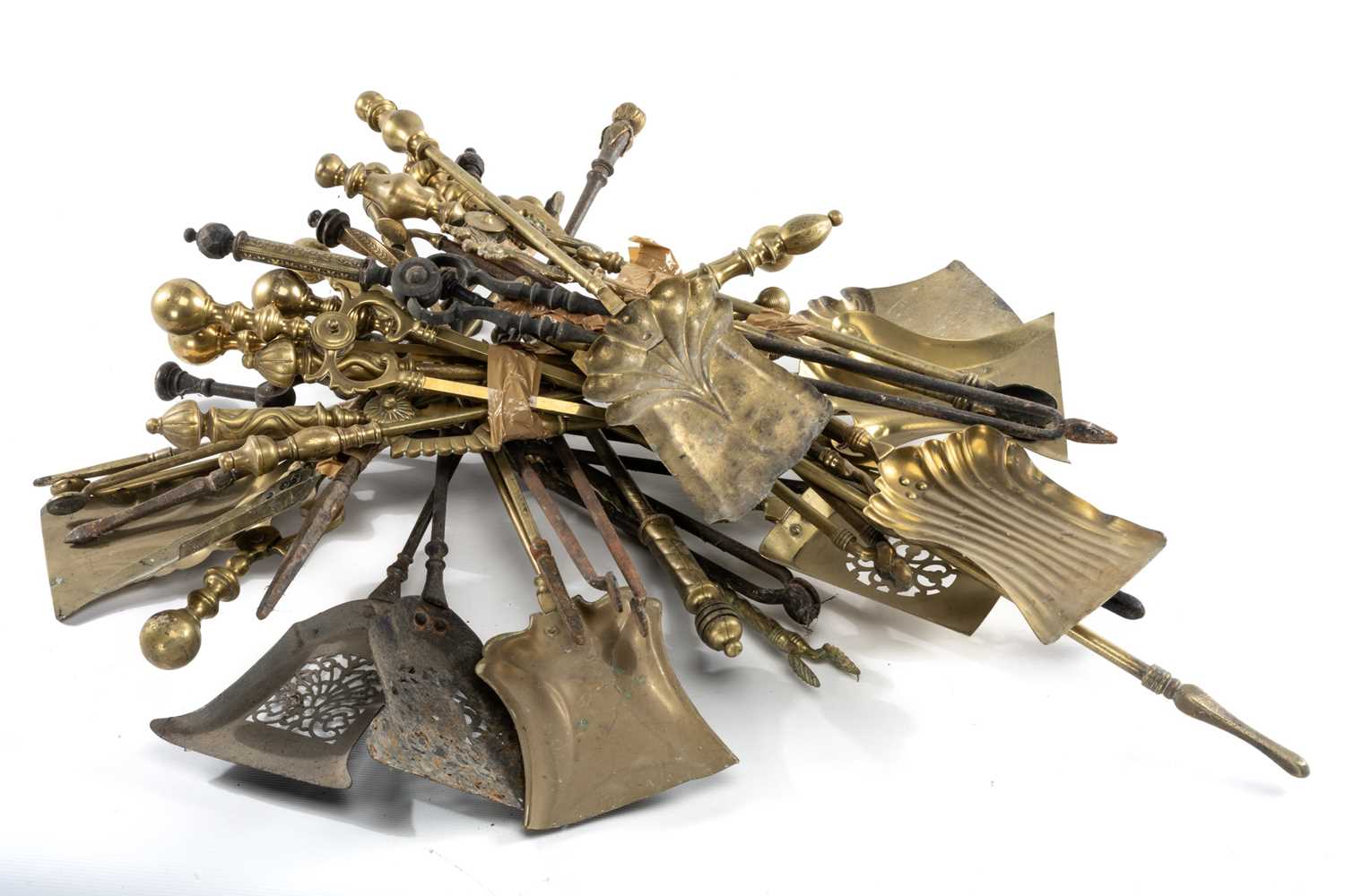 ASSORTED BRASS & CAST IRON FIRE IRONS, various pokers, shovels and tongs (qty) Provenance: The