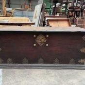DUTCH COLONIAL PADOUK & EBONY TRUNK, applied pierced brass mounts and bosses, heavy swing handles,