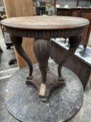 FRENCH CARVED OAK CENTRE TABLE, circular top on bowed lion's paw feet, concave platform base, lion's