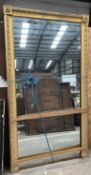 19TH CENTURY LARGE RECTANGULAR GILT FRAMED WALL MIRROR, frame moulded and with applied rosettes to
