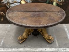 CONTINENTAL PARCEL-GILT OAK DINING TABLE, carved moulded top and frieze, on split column base