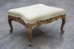 GEORGE III CARVED GILTWOOD SERPENTINE STOOL, probably 18th C., stuffover seat, Rococo carved