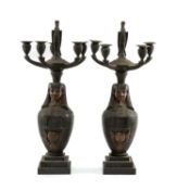 PAIR OF PATINATED BRONZE EGYPTIAN REVIVAL FIVE-LIGHT CANDELABRA, with stork finials above canopic