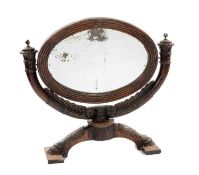 GEORGE IV MAHOGANY TOILET MIRROR, oval plate with reeded frame on acanthus carved bowed support with