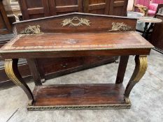 EMPIRE STYLE BRASS APPLIED, PARCEL-GILT & ROSEWOOD PIER TABLE, angled back applied with winged