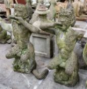 PAIR OF RECONSTITUTED STONE FIGURES OF PAN, seated on tree stumps playing pipes, 98cms (h) Comments: