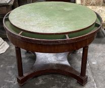 19TH C. CIRCULAR GAMES TABLE on pillar supports and casters with sectional green top, 122cms (diam.)