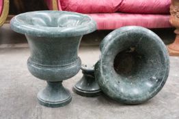 PAIR OF POLISHED GREEN STONE URNS, 52cms (h) Comments: one with badly damaged rim and socle