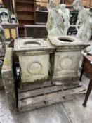 LARGE PAIR OF RECONSTITUTED STONE PEDESTALS, square section, moulded tops above ribbon-tied laurel
