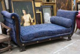 REGENCY STYLE PARCEL-GILT MAHOGANY DAYBED, with scroll ends, floral bosses, blue damask