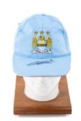 THE FOOTBALL CLUB HOUSE: SIGNED VINCENT KOMPANY MANCHESTER CITY FC BASEBALL HAT, ink signature to