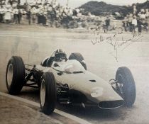 THE MOTORING CLUB HOUSE: GRAHAM HILL SIGNED 1960'S BLACK & WHITE PHOTOGRAPH, believed to be of the