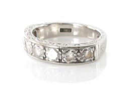 PLATINUM SEVEN STONE DIAMOND HALF ETERNITY RING, the seven round cut diamonds measuring 1.0cts