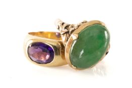 TWO GOLD RINGS, one set with oval cabochon jadeite in 14ct gold, the other with presumed amethyst in