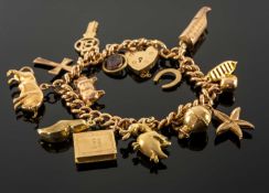 18CT GOLD CURB LINK CHARM BRACELET, 9ct gold heart padlock, with mostly 9ct gold charms and yellow