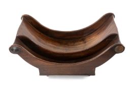 GEORGIAN MAHOGANY CHEESE COASTER, scrolled ends and asymmetric division, on castors, 43.5cms (w)
