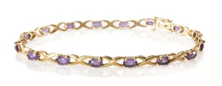 9CT GOLD AMETHYST BRACELET, mounted with 16 oval cut stones on X-link chain, 19cms, 4.8g