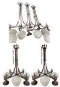 ANTIQUE PATINATED METAL CEILING LIGHTS WITH OPAQUE GLASS SHADES, two with four branches