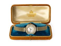 18CT YELLOW & WHITE GOLD DIAMOND SET COCKTAIL / EVENING WATCH, white enamel circular dial