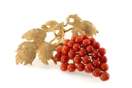 18CT GOLD & CORAL BROOCH, fashioned as a bunch of grapes hanging form leaf and vine branch above