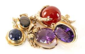 FOUR GOLD PENDANTS & BIRD'S CLAW CHARM, one set with cabochon lapis (on chain) stamped '585'