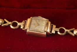 9CT GOLD TUDOR ROYAL LADIES' WRISTWATCH, on 9ct gold 'X' and ball design bracelet, 16.1gms
