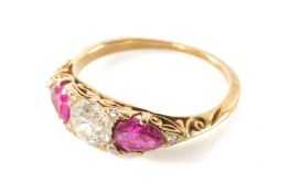 YELLOW METAL THREE-STONE DIAMOND & RUBY RING, central old european cut diamond appr. 0.75cts, rubies
