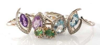 TWO PAIRS AMETHYST OR TOPAZ DRESS RINGS, including pear cut and marquise cut stones within diamond