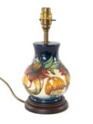 MODERN MOORCROFT 'ANNA LILY' BALUSTER TABLE LAMP, on wood base, 18cms (h) (to rim)