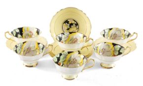SET OF SIX PARAGON FINE BONE CHINA CUPS & SAUCERS, floral pattern on a black ground (12)