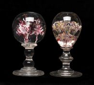 TWO CONTINENTAL 'WIG STAND' PEDESTAL PAPERWEIGHTS, internally decorated with flowers and bubbles