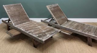 PAIR OF TEAK STEAMER DECK LOUNGERS, integral underside slide trays, rear castors