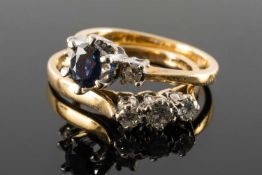 TWO 18CT GOLD RINGS comprising three stone diamond ring and a three stone sapphire and diamond ring