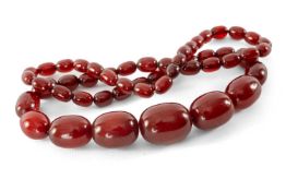 CHERRY AMBER BAKELITE BEAD NECKLACE, largest bead 28 x 20mms, approx. weight 41g, 74cms (l)