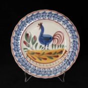 LLANELLY POTTERY COCKEREL PLATE circa 1900, naively painted with a standing cockerel and plants