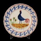 LLANELLY POTTERY COCKEREL PLATE circa 1900, naively painted with a standing cockerel and plants