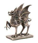 SILVER CAR MASCOT MODELLED AS A WELSH DRAGON standing over a finely textured rectangular base