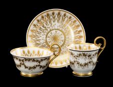 NANTGARW PORCELAIN GILT-PAINTED TRIO, decorated with cornstalks around the inside, star to base