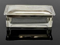 GEORGE V RECTANGULAR GLASS DRESSING TABLE BOX, plain form, with plain domed silver cover, A & J