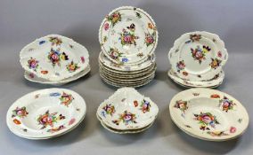 COALPORT OR STYLE TABLEWARE, 19th century, hand painted with floral sprays, nine 24cms (diam.)