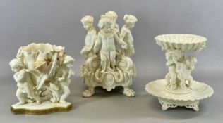 MOORE & CO. CREAM GLAZED FLORAL ENCRUSTED BOWL, supported by three putti, with gilded Grecian key