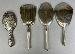 FOUR ANTIQUE SILVER / STERLING BACKED HAND MIRRORS, one with Art Nouveau embossed floral design