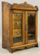 EDWARDIAN OAK SMOKER'S CABINET, two bevel glazed doors inclosing interior fitted with shelves and